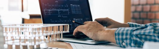 A man working on a laptop.