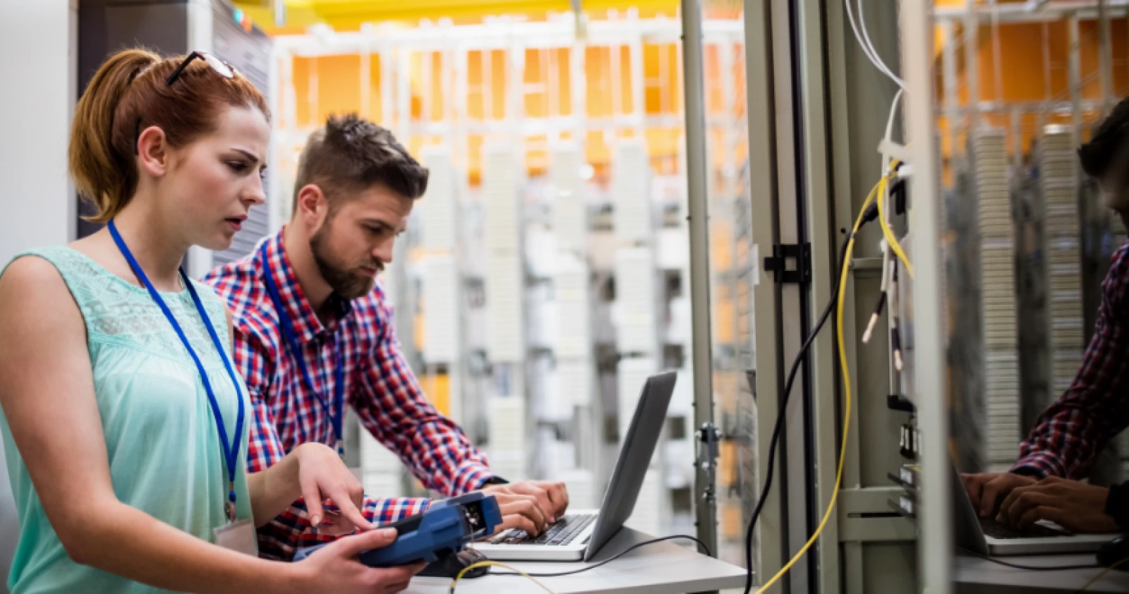 two people solving electrical problem